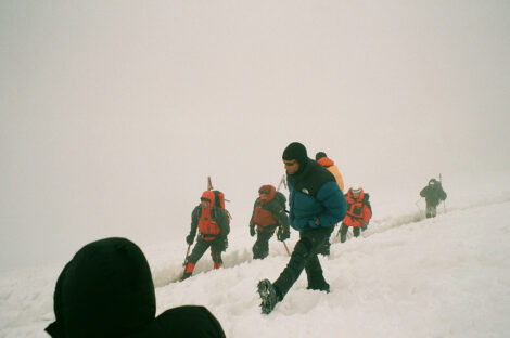 Nicholas Meyler scaling a steep mountain